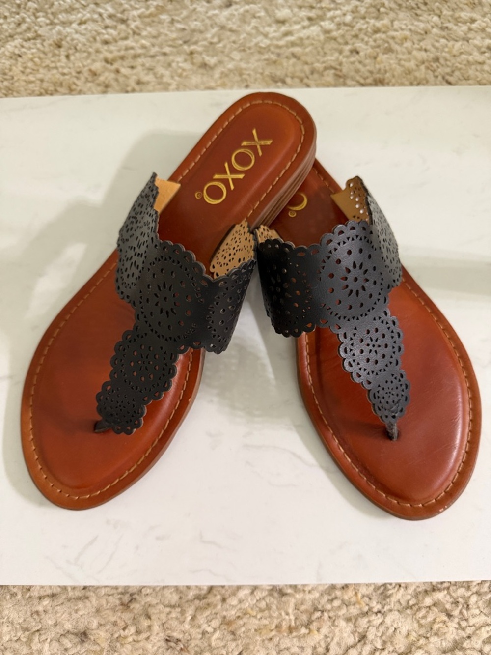 XOXO Black Laser-Cut Toe-Post Sandals with Brown Footbed